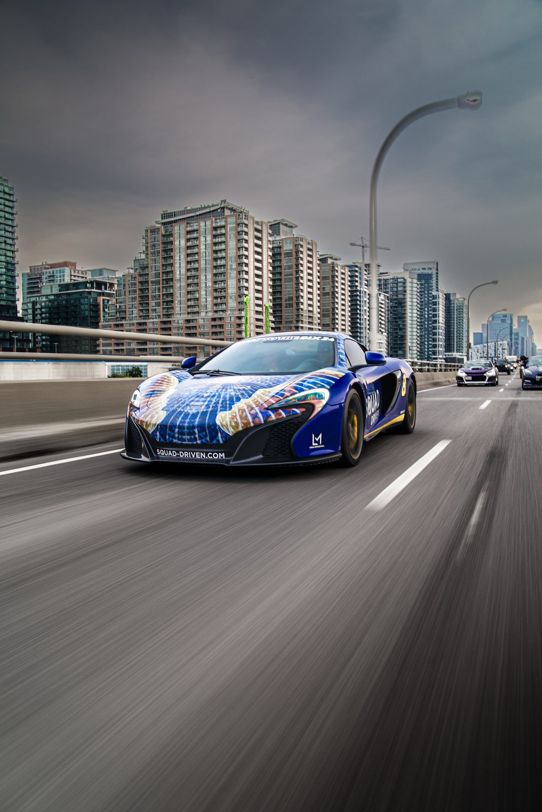 Squad Driven McLaren driving through the city