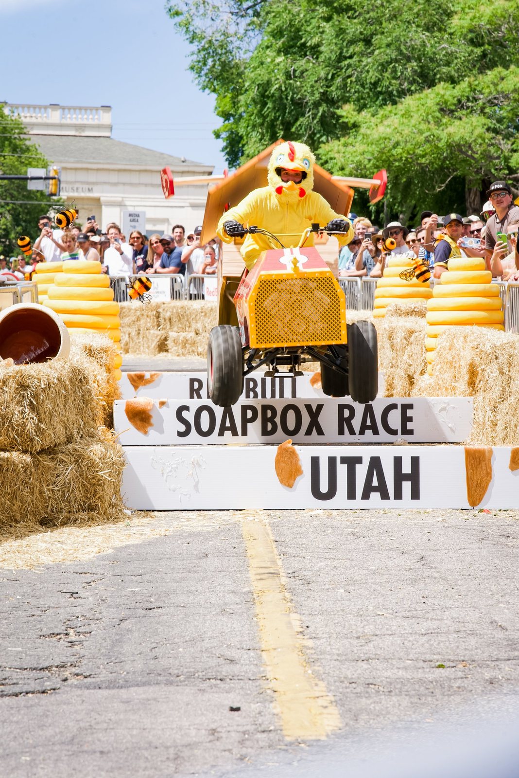 Chicken-costumed racer launching off the jump at the Red Bull Soapbox Race in Utah