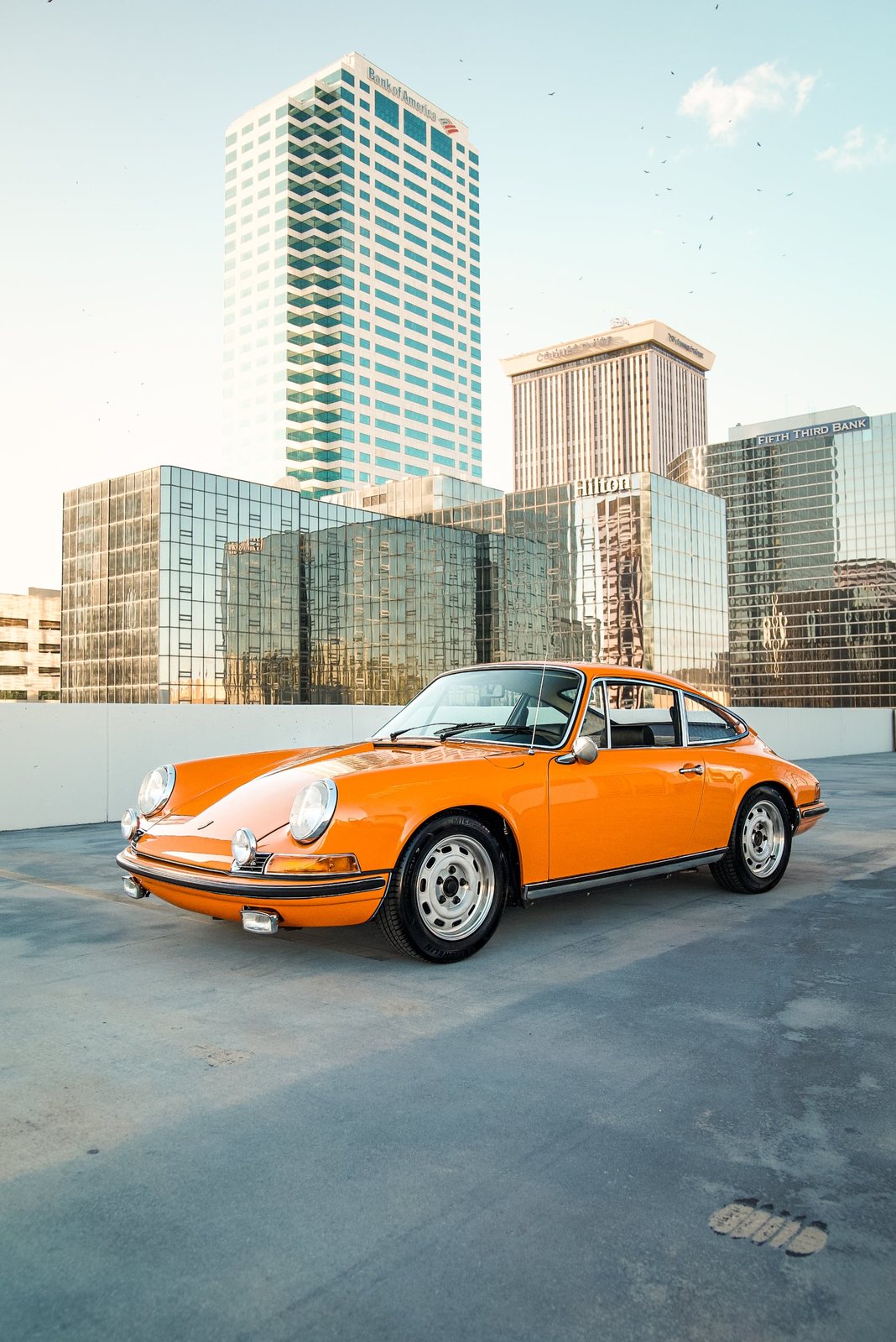 Orange classic Porsche 911 on a downtown Tampa rooftop