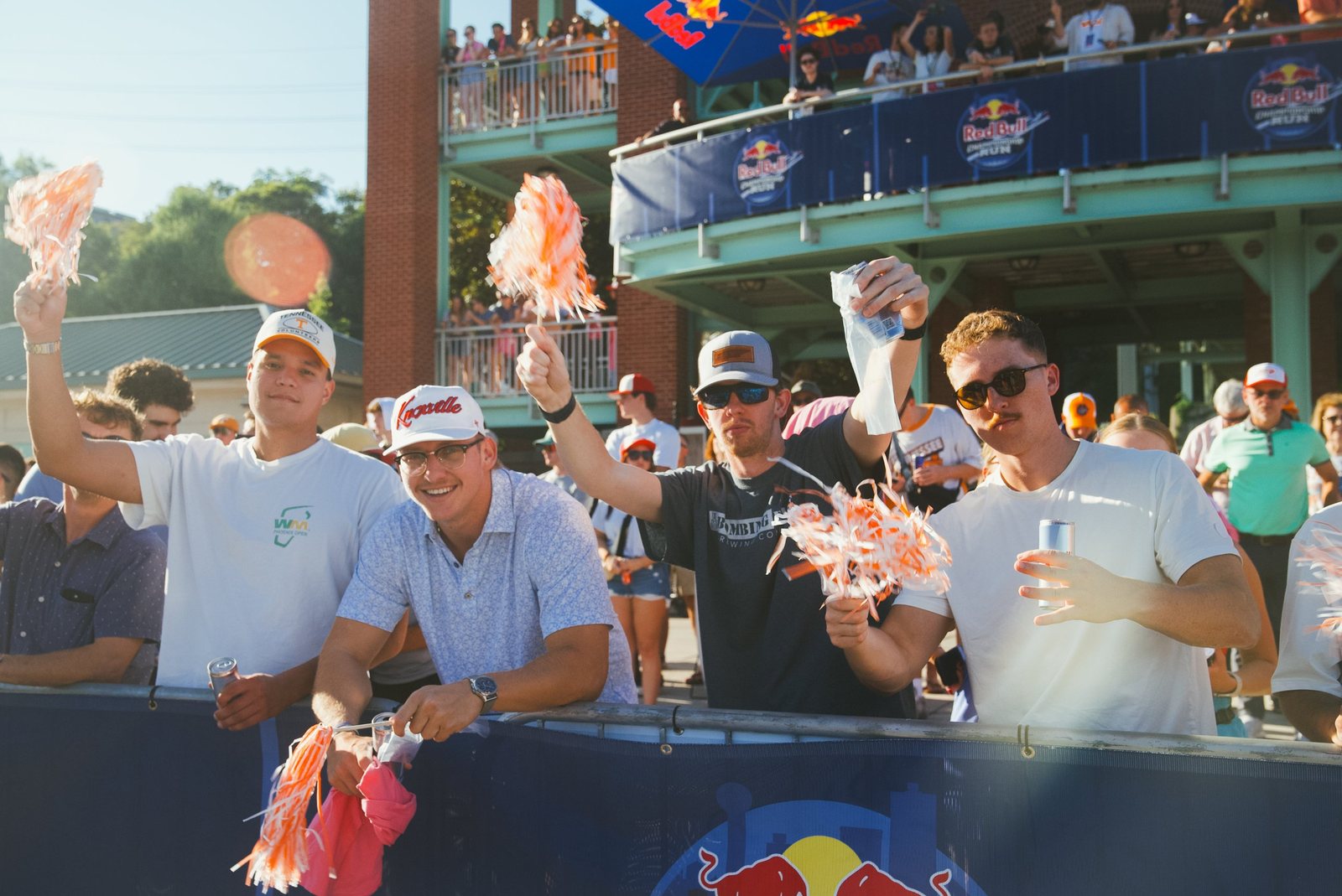 Fans waving orange pom-poms at the Red Bull Championship Run in Knoxville